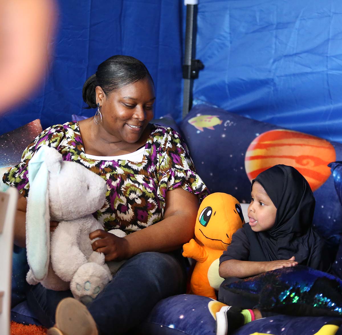 HSA Columbus Primary Teacher and student interacting at a classroom desk